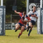 2002 state cships brisbane - barbarians v far northern - ash purvey attempting to break a tackle - pbaba02-004